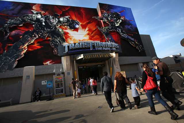 UNIVERSAL CITY, CA - May 4 2012: Guests walk into Transformers: The Ride 3D which opened for special ticket holders at Universal Studios Hollywood May 4, 2012 in Universal City. Opening to the public later this month, Transformers: The Ride 3D is a new ride that puts visitors on the front lines of an intergalactic war between the Autobots and Decepticon. (Brian van der Brug/Los Angeles Times)