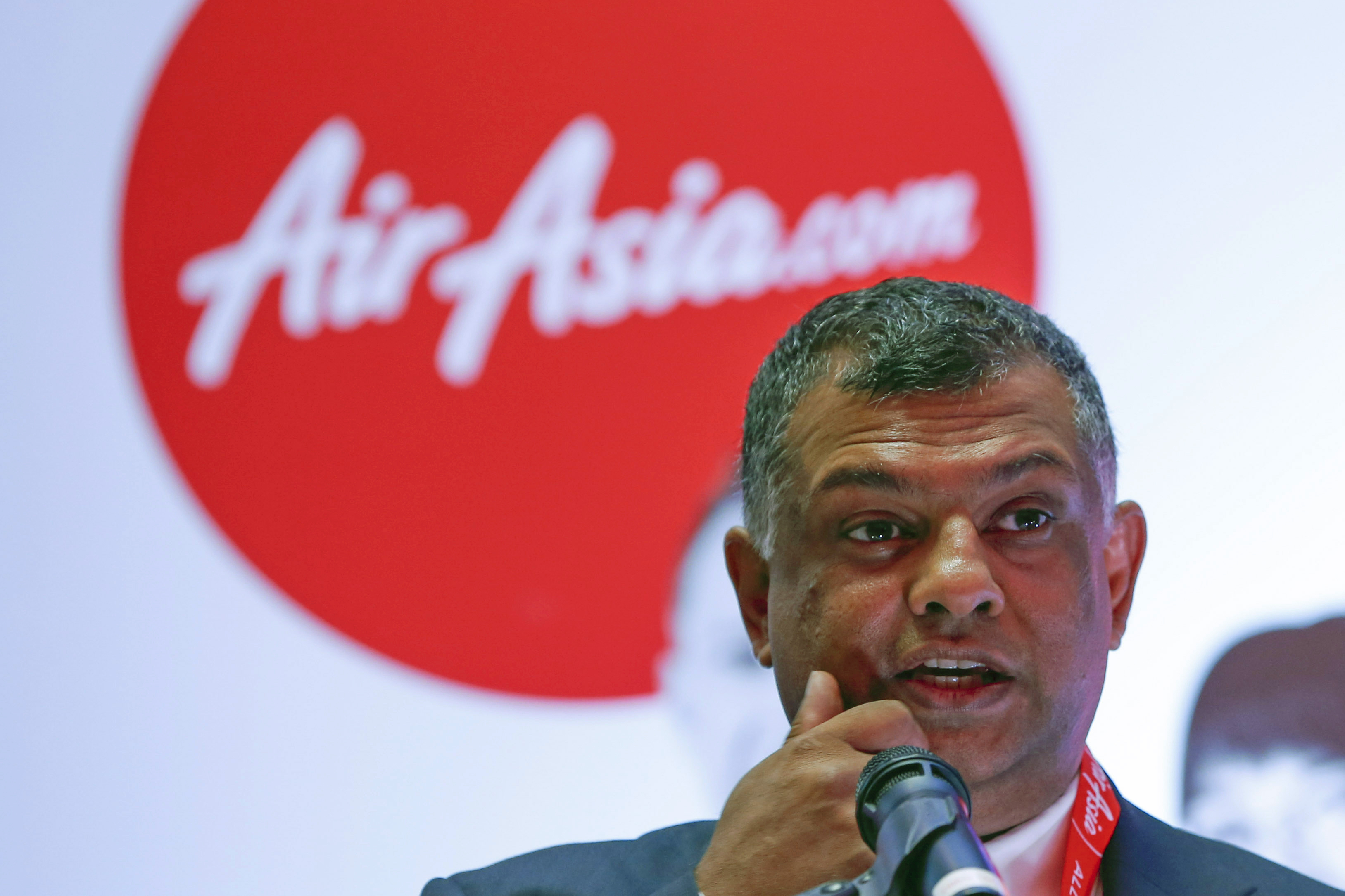 FILE - In an Aug. 11, 2014 file photo, AirAsia Group Chief Executive Officer Tony Fernandes speaks during a press conference in Kuala Lumpur, Malaysia. Fernandes is more than just the CEO of AirAsia: He's the brash personality and cheerleader-like figure who gives the discount carrier its soul. A flamboyant executive who loves race cars and soccer - and is known for speaking his mind, sometimes inappropriately - Fernandes has opened air travel to millions who previously couldnt afford it.  Now, with one of his planes and 162 people onboard missing, Fernandes faces what he's calling his worst nightmare.  (AP Photo/Vincent Thian, File)