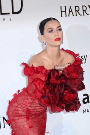 Singer Katy Perry poses for photographers upon arrival at the amfAR Cinema Against AIDS benefit at the Hotel du Cap-Eden-Roc, during the 69th Cannes international film festival, Cap d'Antibes, southern France, Thursday, May 19, 2016. (AP Photo/Joel Ryan)