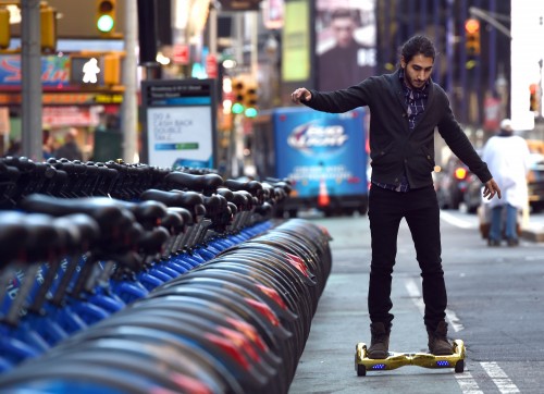 Whizboard Store manager 'Mor Loud' demonstrates the Hoverboard on Broadway in Times Square December 15, 2015. The hot item on many holiday lists will help you zip around town, the shopping mall and from one end of the workplace to another.These so-called "hoverboards" or self-balancing electric scooters, are surging in popularity in the first season where they have been available at relatively affordable prices -- as low as $300 for some models. AFP PHOTO / TIMOTHY A. CLARY / AFP / TIMOTHY A. CLARY (Photo credit should read TIMOTHY A. CLARY/AFP/Getty Images)